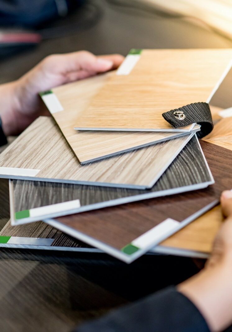 Asian architect man choosing wooden color swatch Asian architect man choosing wooden color swatch | Metro Flooring Contractors